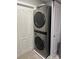 Modern LG washtower in laundry room with folding doors and neutral walls at 5721 Ballinard Ln, Charlotte, NC 28277