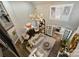 Elegant living room with hardwood floors, neutral decor, and abundant natural light from large windows with shutters at 5721 Ballinard Ln, Charlotte, NC 28277