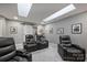 Home theater with comfortable leather recliners, recessed lighting, and a modern design, perfect for entertainment at 5721 Ballinard Ln, Charlotte, NC 28277