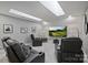 Home theater with leather recliners, large screen, and recessed lighting, perfect for a cinematic experience at 5721 Ballinard Ln, Charlotte, NC 28277