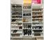Well-organized shoe closet features multiple shelves with various types of footwear at 5721 Ballinard Ln, Charlotte, NC 28277