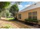 The side yard showcases mature trees and landscaping with an air conditioning unit and exterior siding at 6204 Half Dome Dr, Charlotte, NC 28269
