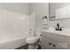 Cozy bathroom with a shower-tub combo, modern vanity with a black faucet, and essential fixtures at 6204 Half Dome Dr, Charlotte, NC 28269