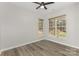Bright bedroom features ample natural light from the two windows and beautiful hardwood floors at 6204 Half Dome Dr, Charlotte, NC 28269