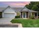 Charming single Gathering home with a well manicured lawn and attached garage at 6204 Half Dome Dr, Charlotte, NC 28269