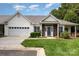 Charming single-story home with a brick facade, manicured lawn, and a two-car garage at 6204 Half Dome Dr, Charlotte, NC 28269