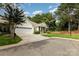 Attractive home with a two-car garage, and well-kept landscaping on a sunny day at 6204 Half Dome Dr, Charlotte, NC 28269