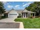 Charming single Gathering home with a well manicured lawn and attached garage at 6204 Half Dome Dr, Charlotte, NC 28269