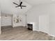 Living room boasting built-in shelving, a fireplace and wood look floors at 6204 Half Dome Dr, Charlotte, NC 28269