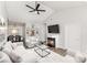 Spacious living room featuring vaulted ceilings, a fireplace and built-in shelving at 6204 Half Dome Dr, Charlotte, NC 28269