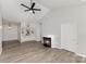 Spacious living room featuring vaulted ceilings, a fireplace and built-in shelving at 6204 Half Dome Dr, Charlotte, NC 28269
