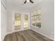 Charming living room features a beautiful view of the outdoors through the french doors and a window at 6204 Half Dome Dr, Charlotte, NC 28269