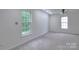 Bright bedroom with neutral carpet and two windows providing natural light at 6310 Trevor Simpson Dr, Indian Trail, NC 28079