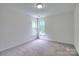 Bedroom featuring carpet, two windows and neutral colored walls at 6310 Trevor Simpson Dr, Indian Trail, NC 28079