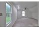 Large bedroom with neutral carpet, a ceiling fan, recessed lighting, and two windows at 6310 Trevor Simpson Dr, Indian Trail, NC 28079