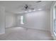 Spacious bedroom with neutral carpet, a ceiling fan, recessed lighting, and natural light at 6310 Trevor Simpson Dr, Indian Trail, NC 28079