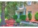 Charming home with a welcoming entrance, neat landscaping, and a combination of brick and siding at 6310 Trevor Simpson Dr, Indian Trail, NC 28079