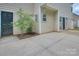 Back patio area with door and windows to the home at 6310 Trevor Simpson Dr, Indian Trail, NC 28079