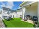 Backyard with artificial grass, patio, and privacy fence offers a perfect outdoor living space at 651 Melville Dr, Rock Hill, SC 29732