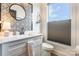 Bright bathroom featuring a patterned mirror, white vanity, and a window providing natural light at 651 Melville Dr, Rock Hill, SC 29732