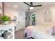Bedroom with a ceiling fan, a doorway to the bathroom, and a desk with lots of storage at 651 Melville Dr, Rock Hill, SC 29732
