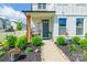 Charming front porch with cozy swing, landscaped plants, and a welcoming entrance at 651 Melville Dr, Rock Hill, SC 29732