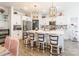 Bright kitchen with white cabinets, stainless steel appliances, oversized island, and decorative pendant lights at 651 Melville Dr, Rock Hill, SC 29732