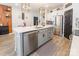 Kitchen island with stainless steel appliances, modern cabinets, gold faucet, and gray rug at 651 Melville Dr, Rock Hill, SC 29732