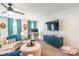Bright living room with a modern desk, ceiling fan, and comfortable seating area at 651 Melville Dr, Rock Hill, SC 29732