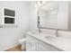 Bright bathroom featuring double sinks, a large mirror and a modern vanity with elegant countertop at 737 Oak St, Charlotte, NC 28214