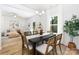 Elegant dining room with contemporary furnishings, views into the living room at 737 Oak St, Charlotte, NC 28214