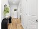 Bright foyer with hardwood floors, a stylish console table, and a welcoming atmosphere at 737 Oak St, Charlotte, NC 28214