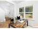 Cozy home office featuring a wooden desk, a large window with a view, and a comfortable workspace at 737 Oak St, Charlotte, NC 28214