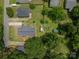 Aerial view of home with fenced yard, lush trees and in-ground pool with deck and small storage shed at 792 Carolina Mill Cir, Lincolnton, NC 28092