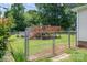 Backyard view with in-ground pool deck, chain link fence and lawn at 792 Carolina Mill Cir, Lincolnton, NC 28092