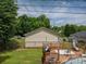 Backyard featuring a wooden deck, above-ground pool, and green lawn at 792 Carolina Mill Cir, Lincolnton, NC 28092