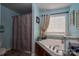 Cozy bathroom featuring a garden tub, neutral color scheme, and granite countertop at 792 Carolina Mill Cir, Lincolnton, NC 28092