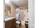 Compact bathroom featuring a tiled floor, granite countertop, sink, toilet, and tub/shower combo at 792 Carolina Mill Cir, Lincolnton, NC 28092