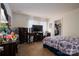 Spacious bedroom with a TV, two dressers, walk-in closet, and patterned bedspread at 792 Carolina Mill Cir, Lincolnton, NC 28092