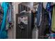 A cluttered closet with a gun safe, clothes, and a TV at 792 Carolina Mill Cir, Lincolnton, NC 28092