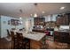 Kitchen featuring granite countertops, a large island with seating, and modern appliances at 792 Carolina Mill Cir, Lincolnton, NC 28092