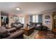 Inviting living room with hardwood floors, comfortable seating, and plenty of natural light at 792 Carolina Mill Cir, Lincolnton, NC 28092