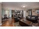 Open-concept living area with hardwood floors and a seamless flow into the dining area at 792 Carolina Mill Cir, Lincolnton, NC 28092