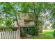 Exterior view of a house with a screened patio, balcony, and mature trees at 8005 Horse Chestnut Ln, Charlotte, NC 28277