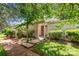 Charming home exterior with lush landscaping and inviting walkway at 8005 Horse Chestnut Ln, Charlotte, NC 28277