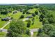 This aerial view highlights the home's location and extensive landscaping at 801 Witmore Rd, Wingate, NC 28174