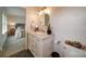 This bathroom features tile floors, a large vanity, and plants for decor at 801 Witmore Rd, Wingate, NC 28174