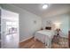 Cozy bedroom with wood floors, neutral walls and view of the dining room at 801 Witmore Rd, Wingate, NC 28174