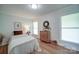 Bright bedroom with hardwood floors, neutral walls, and ample natural light at 801 Witmore Rd, Wingate, NC 28174