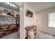 This walk-in closet offers plenty of storage space and hanging rods at 801 Witmore Rd, Wingate, NC 28174